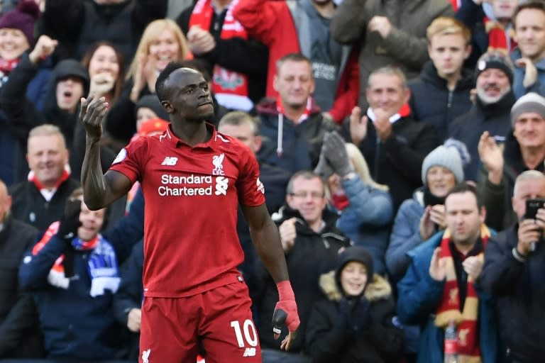 Sadio Mane celebrates after scoring his first goal and Liverpool's second in a 4-1 win at home to Cardiff