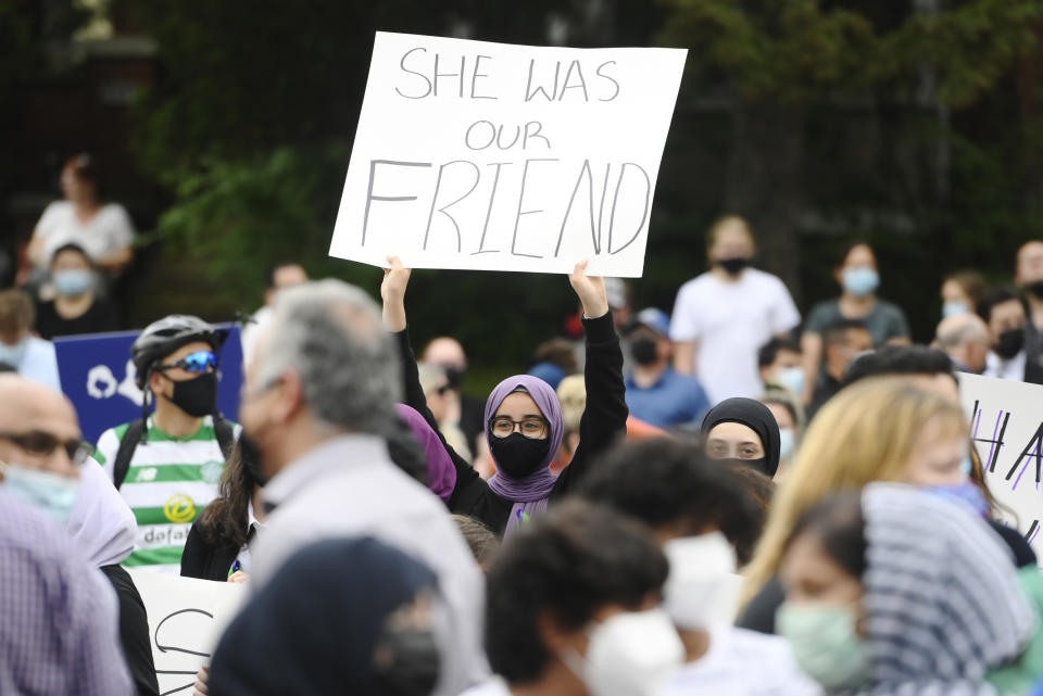 <p>A young woman holds a sign as she attends a vigil outside the London Muslim Mosque for the victims of the deadly vehicle attack on five members of the Canadian Muslim community in London, Ont., on Tuesday, June 8, 2021. Four of the members of the family died and one is in critical condition. Police have charged a London man with four counts of murder and one count of attempted murder. THE CANADIAN PRESS/Nathan Denette</p> 