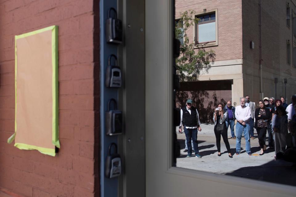 The Society of Professional Journalists unveils a plaque about Ochs. It's next to a bar; "I think Adolph Ochs would like that," said Vines.