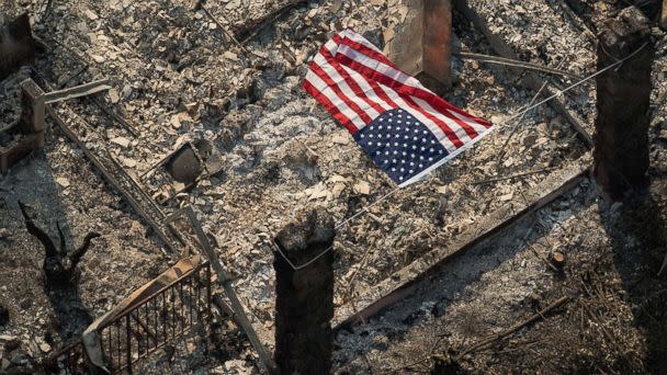 PHOTO: An American flag flies over the remains of a Coffey Park home following the Tubbs fire in Santa Rosa, Calif. (Noah Berger/San Francisco Chronicle/Polaris)