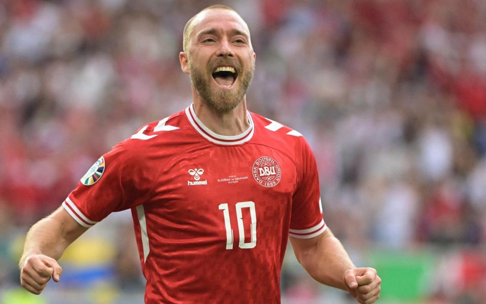 Christian Eriksen celebrates after giving Denmark the lead with a lovely goal.