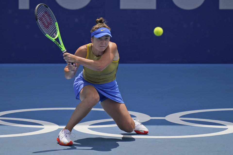 Elina Svitolina, of the Ukraine, plays Camila Giorgi, of Italy, during the quarterfinals of the tennis competition at the 2020 Summer Olympics, Wednesday, July 28, 2021, in Tokyo, Japan. (AP Photo/Seth Wenig)