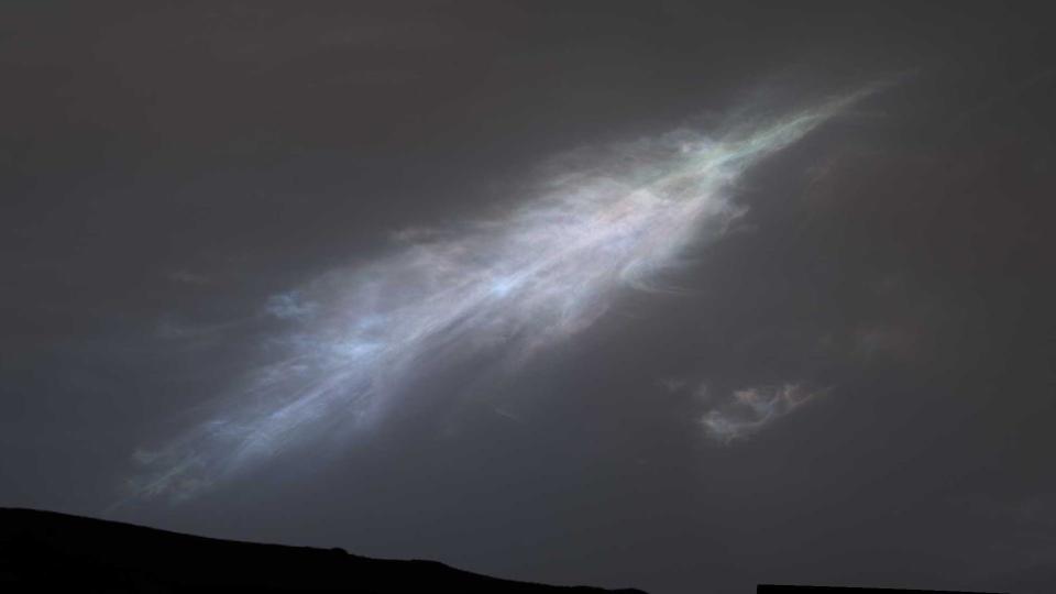 a colorful streak of light in the dark Martian skies