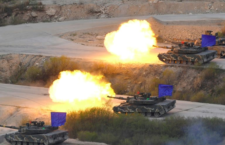 South Korean K1A2 tanks fire live rounds during a joint live firing drill between South Korea and the US at the Seungjin Fire Training Field in Pocheon on April 26, 2017