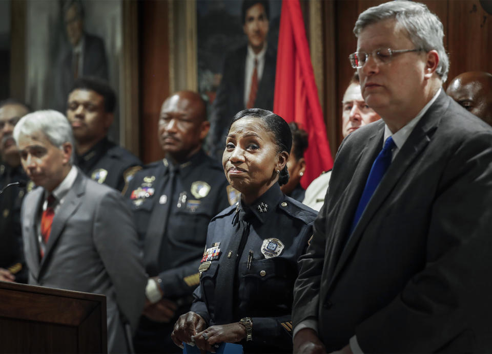 Memphis Police Director Cerelyn "CJ" Davis, center, attends a midnight news conference on Thursday, Sept. 8, 2022. Police in Memphis, Tennessee, said a man who drove around the city shooting at people, killing several, during an hours-long rampage that forced frightened people to shelter in place Wednesday has been arrested. (Mark Weber/Daily Memphian via AP)