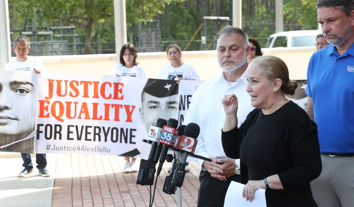 Maria Lourdes Ortiz, the mother of Alexander Bello-Ortiz, speaks to the media with her husband and Alex's stepfather, Harold Dolph, and attorney John Phillips, Monday, March 27, 2023, during a press conference in front of the Daytona Beach Police Department.