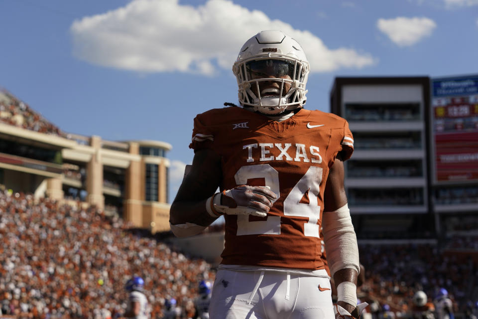 Texas running back Jonathon Brooks (24) celebrates as he scores on a touchdown run against Kansas during the second half of an NCAA college football game in Austin, Texas, Saturday, Sept. 30, 2023. (AP Photo/Eric Gay)