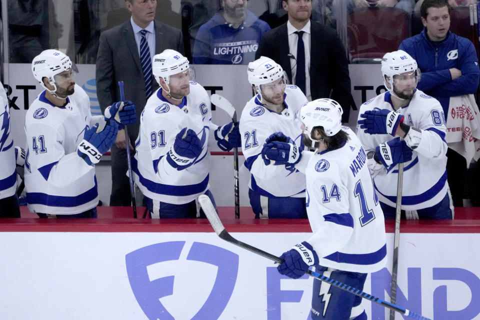 Tampa Bay Lightning's Pat Maroon (14) celebrates his goal with teammates during the first period of an NHL hockey game against the Chicago Blackhawks Tuesday, Jan. 3, 2023, in Chicago. (AP Photo/Charles Rex Arbogast)