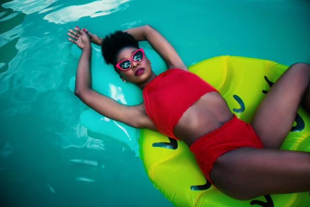 woman on floatie in the pool - destinations transformed by tourism