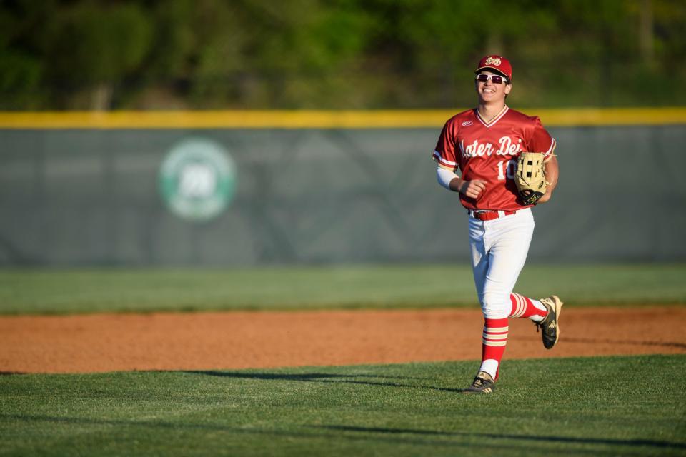 Mater Dei’s Bryce Humphrey (10) smiles as he runs off the field following the Wildcat’s 12-4 win against the North Huskies at North High School in Evansville, Ind., Friday, April 30, 2021.