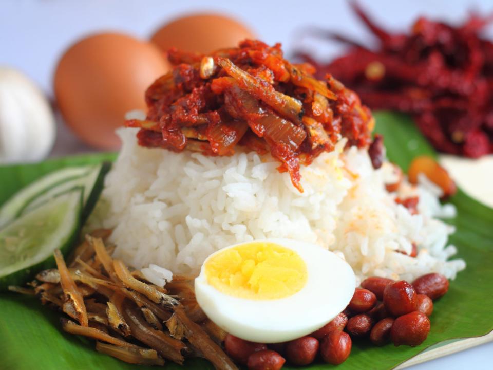 Nasi lemak is a Malay fragrant rice dish cooked in coconut milk and pandan leaf. It is commonly found in Malaysia.