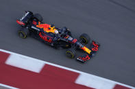 Red Bull driver Max Verstappen, of the Netherlands, moves into a turn during a practice session for the F1 US Grand Prix auto race at Circuit of the Americas, Friday, Oct. 22, 2021, in Austin, Texas. (AP Photo/Nick Didlick)