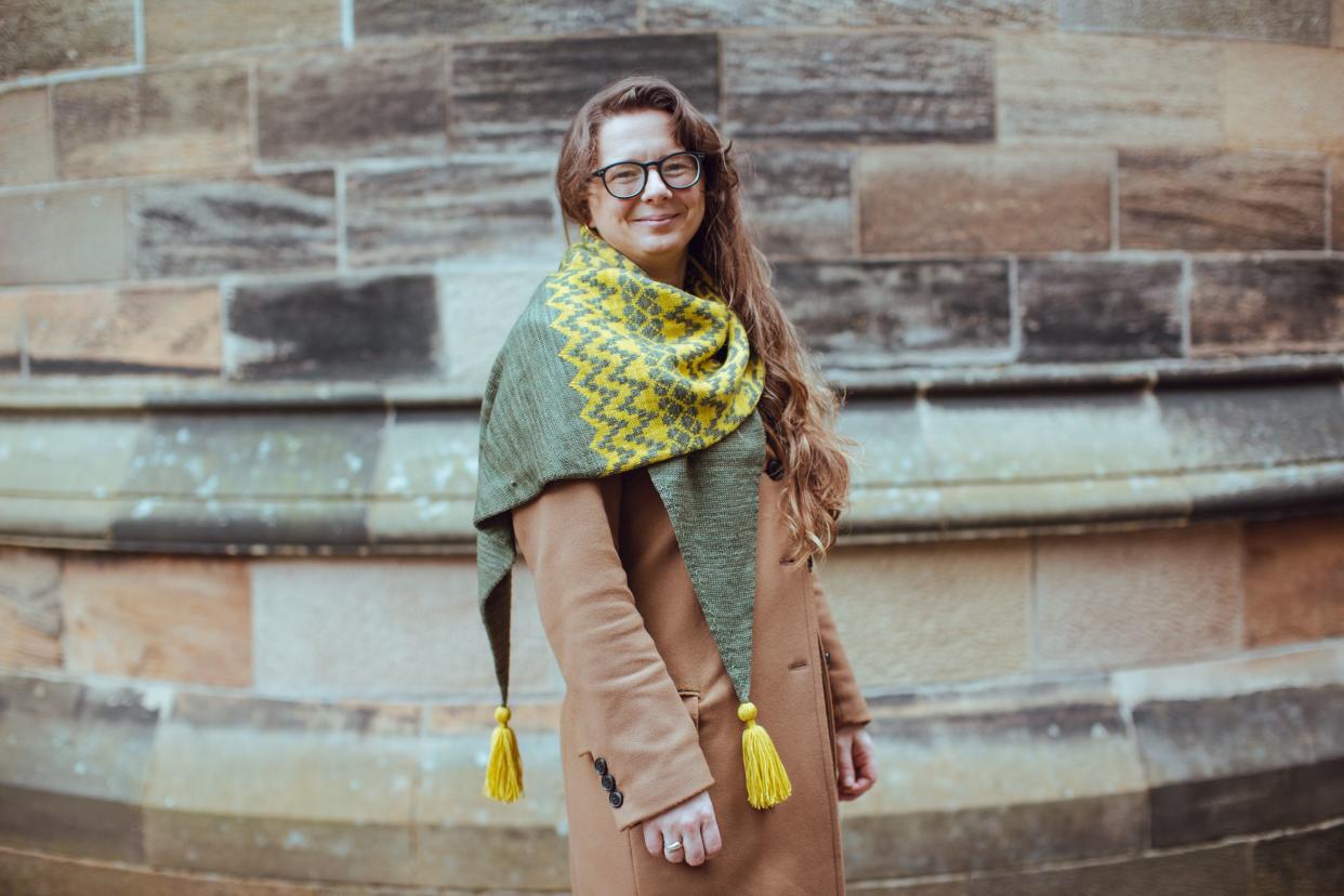 A woman models a yellow scarf inspired by Glasgow University (University of Glasgow/PA)