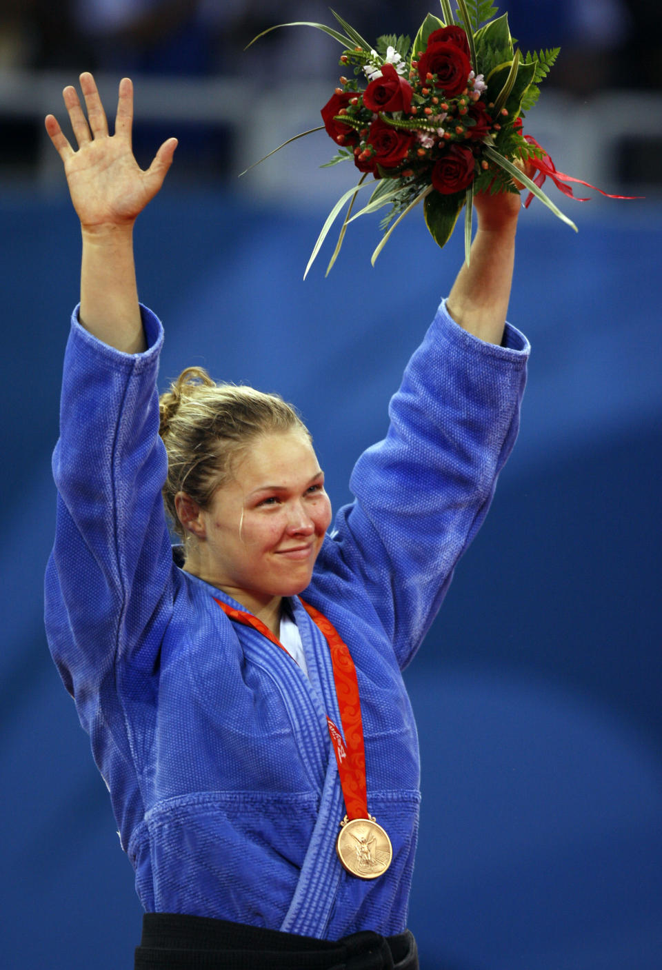 Bronze medalist Ronda Rousey of the United States, celebrates during the medals ceremony for the women's -70kg judo middleweight division finals at the Beijing 2008 Olympics in Beijing, Wednesday, Aug. 13, 2008. (AP Photo/Charles Dharapak)