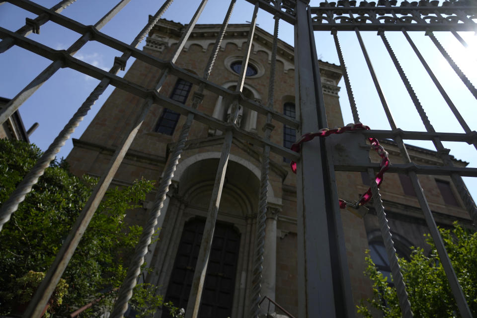 A view of a former monastery, in Rome, Monday, May 29, 2023, situated on a quiet residential street. It once sheltered Jews fleeing deportation in World War II. Purchased by the Vatican in 2021 as a dormitory for foreign nuns studying at Rome’s pontifical universities, the building now stands empty, a collateral victim of the latest financial scandal to hit the Holy See. (AP Photo/Alessandra Tarantino)