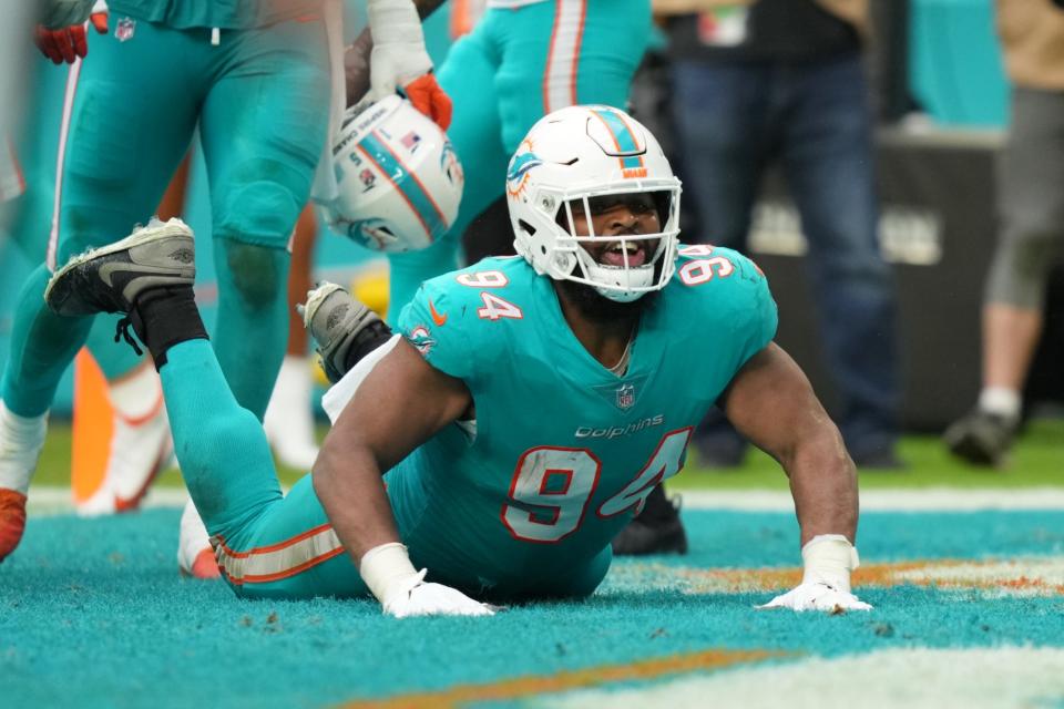 Defensive tackle Christian Wilkins celebrates scoring a touchdown vs. the Jets by doing The Worm in the end zone.