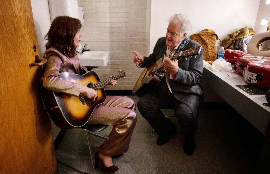 Molly Tuttle and Peter Rowan run through a song in a dressing room backstage at the 2022 IBMA Awards show in Raleigh, N.C., Sept. 29, 2022. Tuttle won Female Vocalist of the Year while Rowan was inducted into the Bluegrass Music Hall of Fame. Scott Sharpe/ssharpe@newsobserver.com