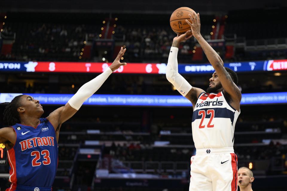 Wizards guard Monte Morris (22) shoots against Pistons guard Jaden Ivey during the first half on Tuesday, Oct. 25, 2022, in Washington.