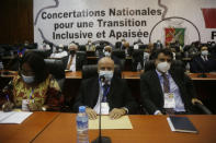 Ambassadors and foreign representations, wait for meeting with Military junta led by Col. Mamady Doumbouya, at the people's palace in Conakry, Guinea Wednesday, Sept. 15, 2021. Guinea's junta is expected to face more pressure to set a timeframe for new elections Tuesday as the military rulers open a four-day series of meetings about the West African nation's future following the president's overthrow in a coup just over a week ago. (AP Photo/Sunday Alamba)