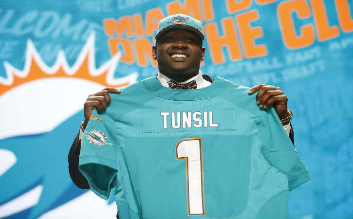 Apr 28, 2016; Chicago, IL, USA; Laremy Tunsil (Mississippi) is selected by the Miami Dolphins as the number thirteen overall pick in the first round of the 2016 NFL Draft at Auditorium Theatre. Mandatory Credit: Kamil Krzaczynski-USA TODAY Sports