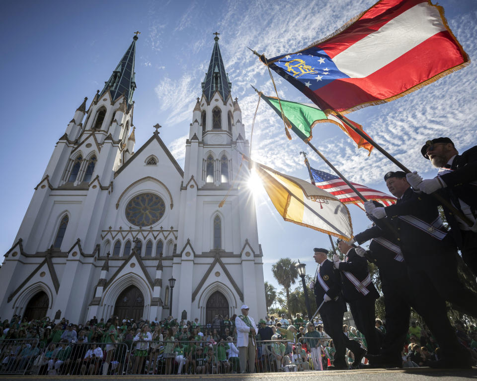 An honor guard leads a group of dignitaries past the Cathedral of St. John the Baptist during the beginning of the 200th anniversary of Savannah''s St. Patrick's Day parade, Saturday, March 16, 2024, in Savannah, Ga. The parade lineup featured at least 230 pipe-and-drum bands, dignitaries, marching military units and shamrock-decorated floats. (Stephen B. Morton/Atlanta Journal-Constitution via AP)