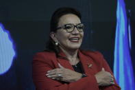 Free Party presidential candidate Xiomara Castro greets her supporters after general elections, in Tegucigalpa, Honduras, Sunday, Nov. 28, 2021. Castro claimed victory, setting up a showdown with the National Party which said its candidate had won a vote that could end the conservative party's 12 years in power. (AP Photo/Moises Castillo)