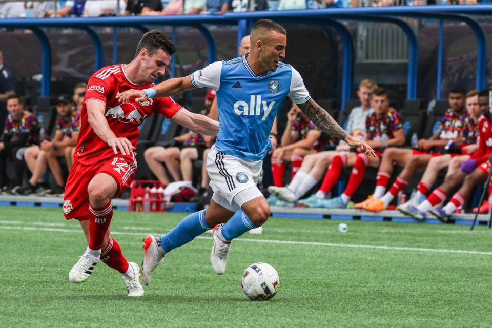 Charlotte FCs Andre Shinyashiki, right, dribbles the ball away from New York Red Bulls Dylan Nealis during the game at Bank of America Stadium on Saturday, June 11, 2022 in Charlotte, NC. Melissa Melvin-Rodriguez/mrodriguez@charlotteobserver.com