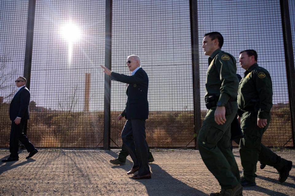 US President Joe Biden walks along the US-Mexico border fence in El Paso, Texas, on January 8, 2023. (AFP via Getty Images)