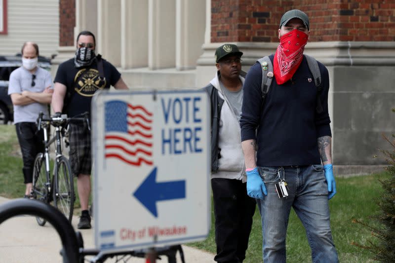 FILE PHOTO: Voters wait to cast ballots during the presidential primary election in Wisconsin