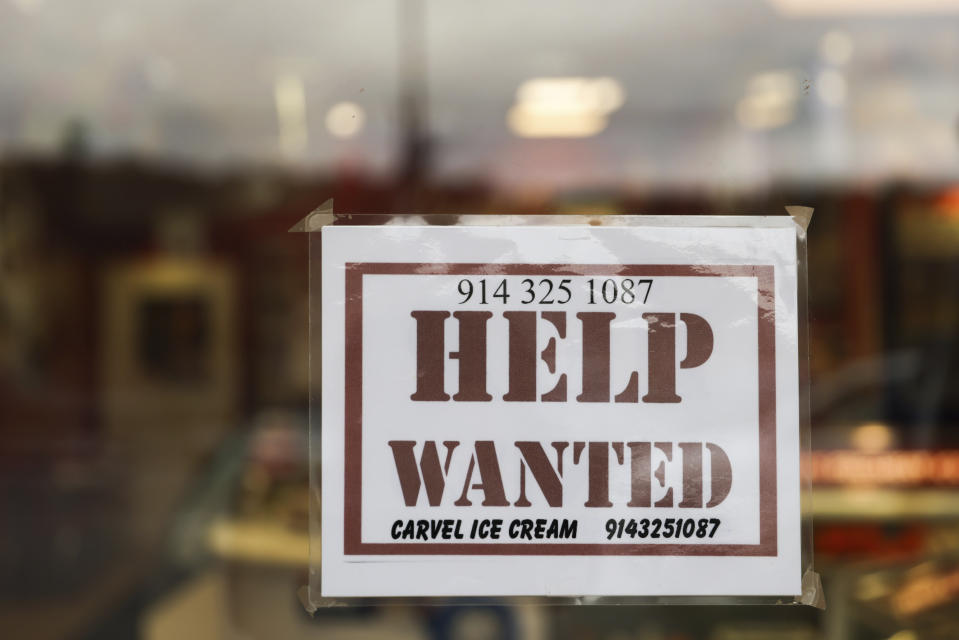 A help wanted sign is displayed in a storefront, Tuesday, Nov. 1, 2022, in Bedford, N.Y. Employers have added a healthy average of 407,000 jobs a month, and the unemployment rate is just 3.7%, close to a half-century low. (AP Photo/Julia Nikhinson)