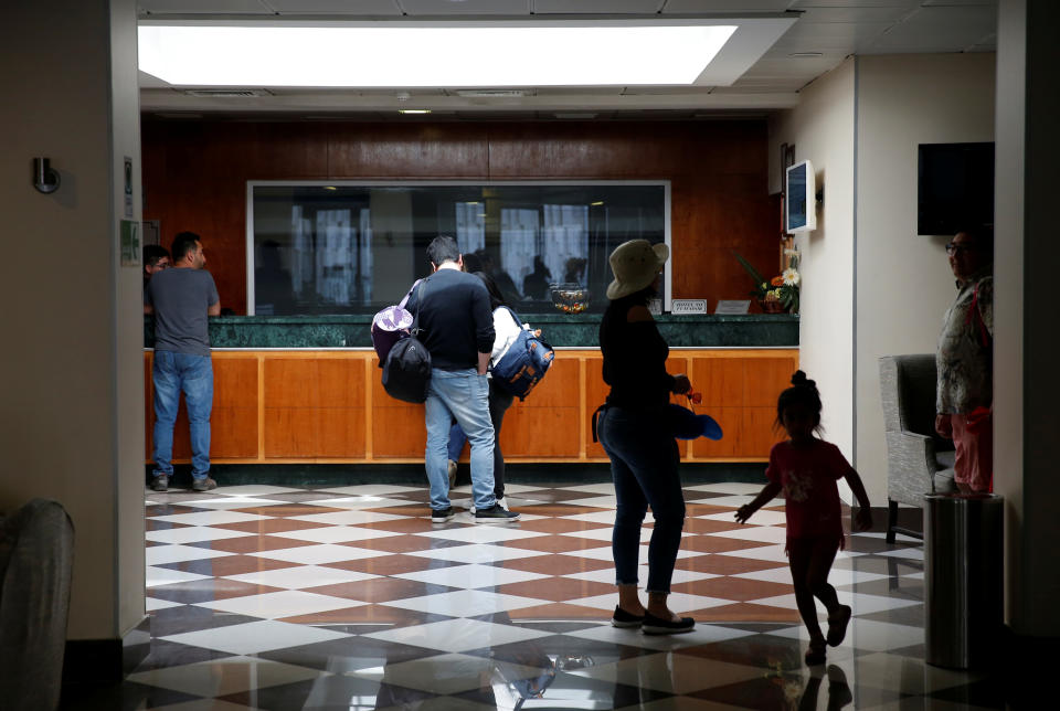 People are seen in the reception of a hotel in Valparaiso, Chile on November 1, 2019. (REUTERS/Rodrigo Garrido)