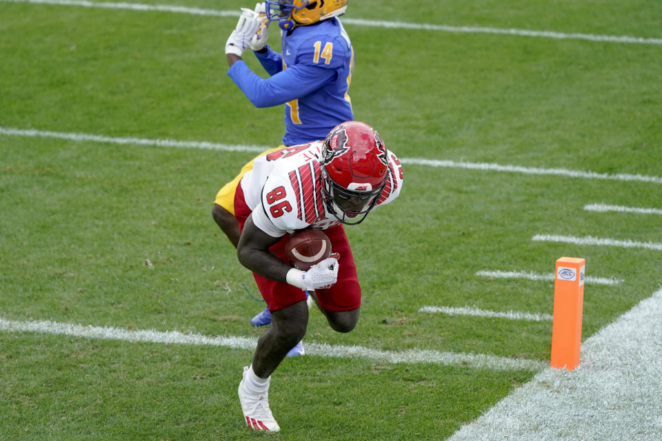 North Carolina State wide receiver Emeka Emezie (86) makes a catch for a touchdown past Pittsburgh Panthers defensive back Marquis Williams (14) in the first half of an NCAA college football game, Saturday, Oct. 3, 2020, in Pittsburgh. (AP Photo/Keith Srakocic)