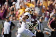 Minnesota running back Treyson Potts runs for a touchdown in the first half of an NCAA college football game against Colorado, Saturday, Sept. 18, 2021, in Boulder, Colo. (AP Photo/David Zalubowski)