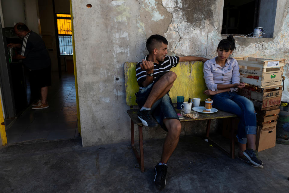 Lucas, 24, a former tuberculosis patient, talks to a colleague during his lunch break at Masantonio Organization in Buenos Aires, Argentina, Jan. 11, 2019. Lucas works for the Masantonio Organization where he visits tuberculosis patients with no family, helping them with their TB treatment and recovery. (Photo: Magali Druscovich/Reuters)