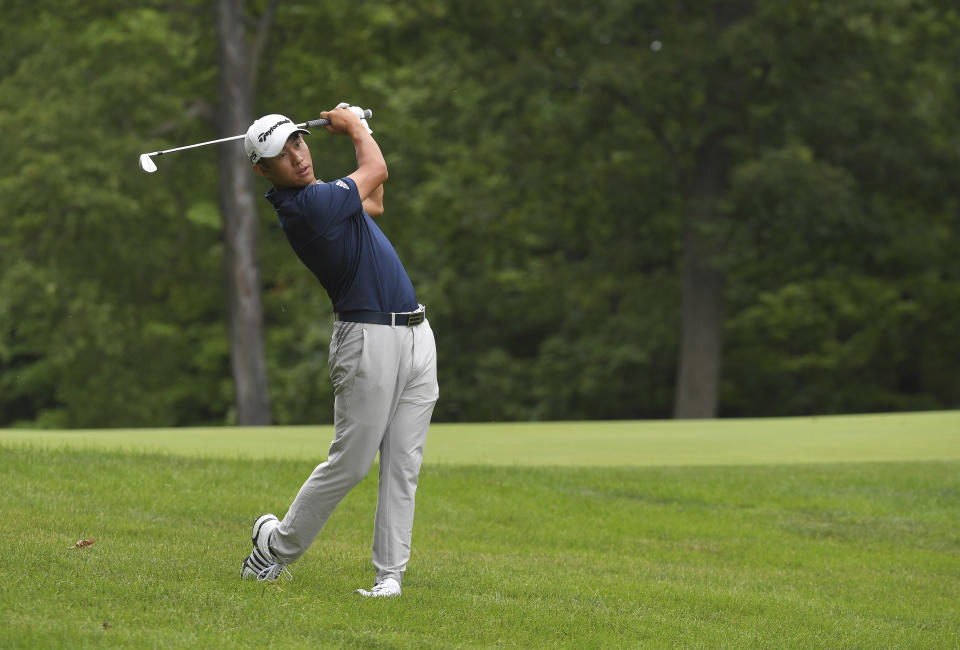 Collin Morikawa hits a shot on the 15th hole.