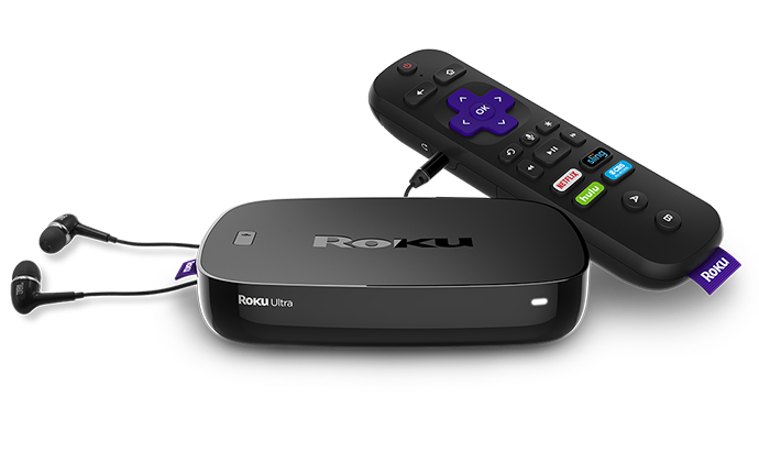 A shot of Roku's Ultra streaming video players with a remote and ear buds.
