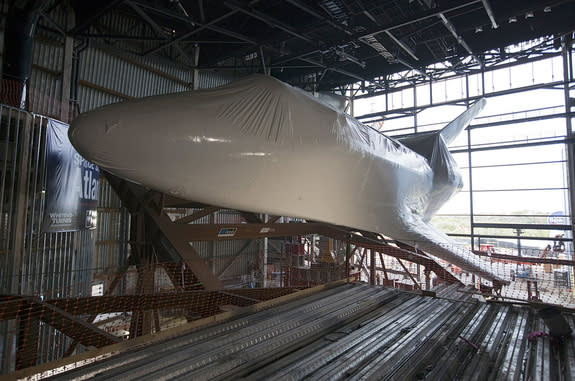 Space shuttle Atlantis, seen here after being lifted and tilted inside its new $100 million exhibit facility at the Kennedy Space Center Visitor Complex in Florida