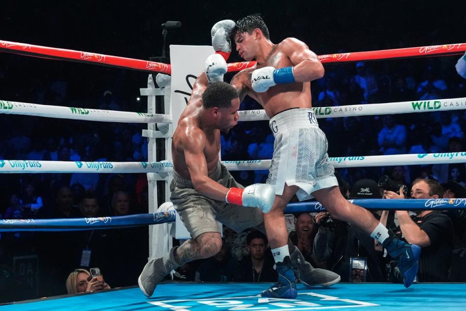 Garcia (right) floored Haney three times en route to a majority-decision win (AP)