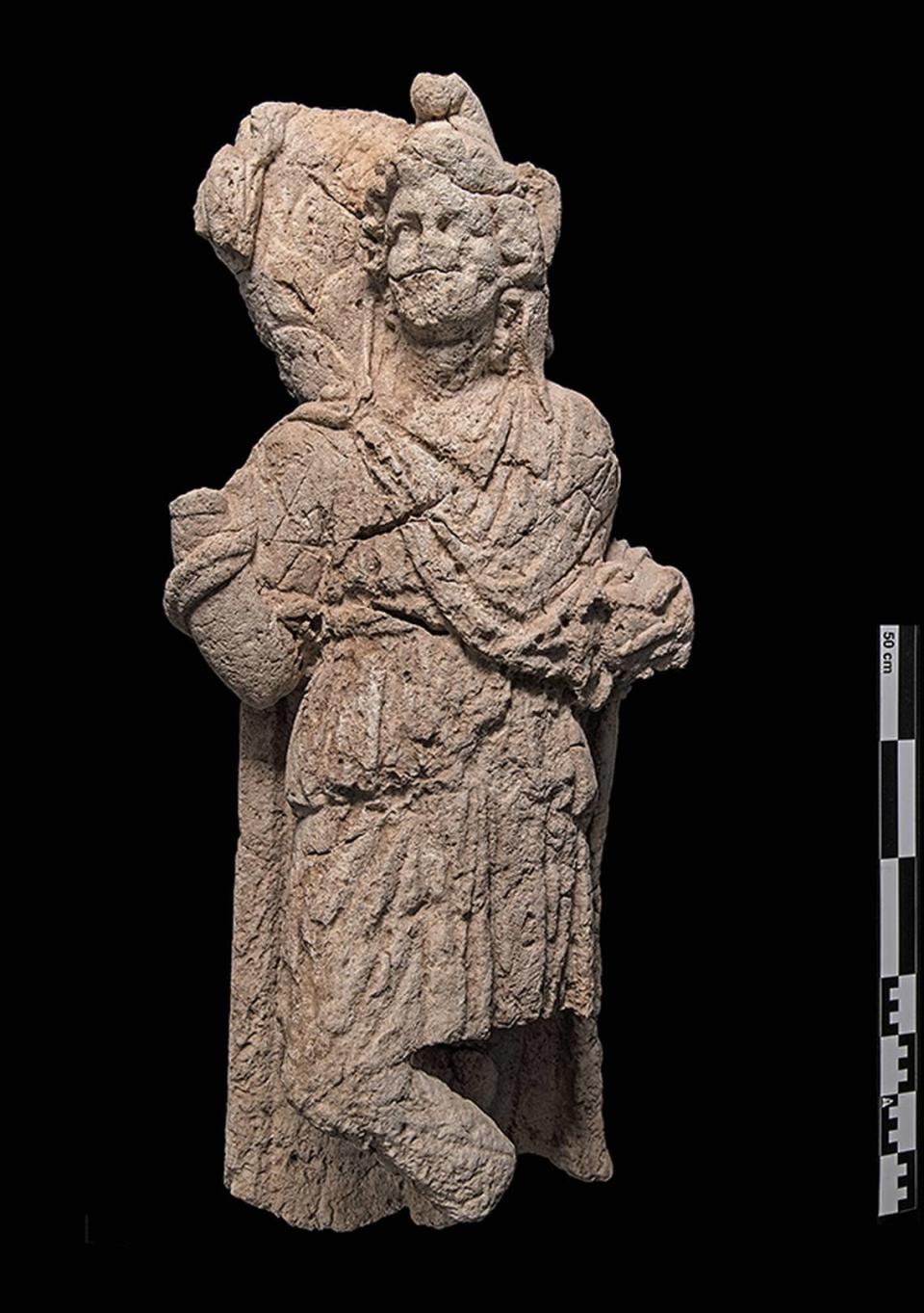 The statue of Cautes, a torch bearer of Mithras, found at the site.