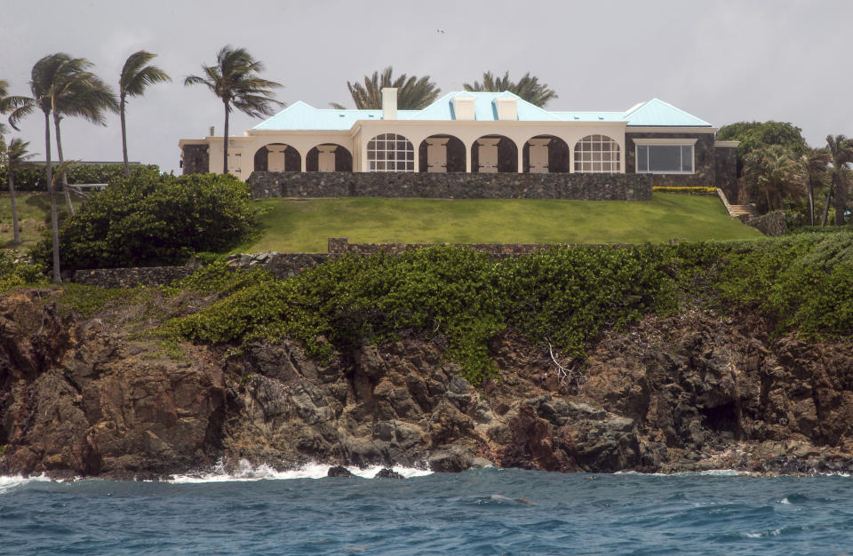 This Tuesday, July 9, 2019 photo shows a structure on Little Saint James Island, in the U. S. Virgin Islands. Locals recalled seeing Jeffery Epstein's black helicopter flying back and forth from the international airport in St. Thomas to his helipad on Little St. James Island, where he built a cream colored mansion with a bright turquoise roof surrounded by several other structures including the maids' quarters and a massive, square-shaped white building on one end of the island that some say is a music room fitted with acoustic walls. (AP Photo/Gianfranco Gaglione)