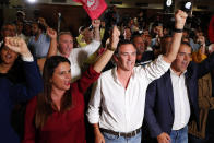 Supporters of Portuguese Prime Minister and Socialist Party leader Antonio Costa react following the announcement of firsts election results in Lisbon Sunday night, Oct. 6, 2019. An exit poll indicates the center-left Socialist Party has collected the most votes in Portugal's general election and is poised to continue in government for another four years. (AP Photo/Armando Franca)