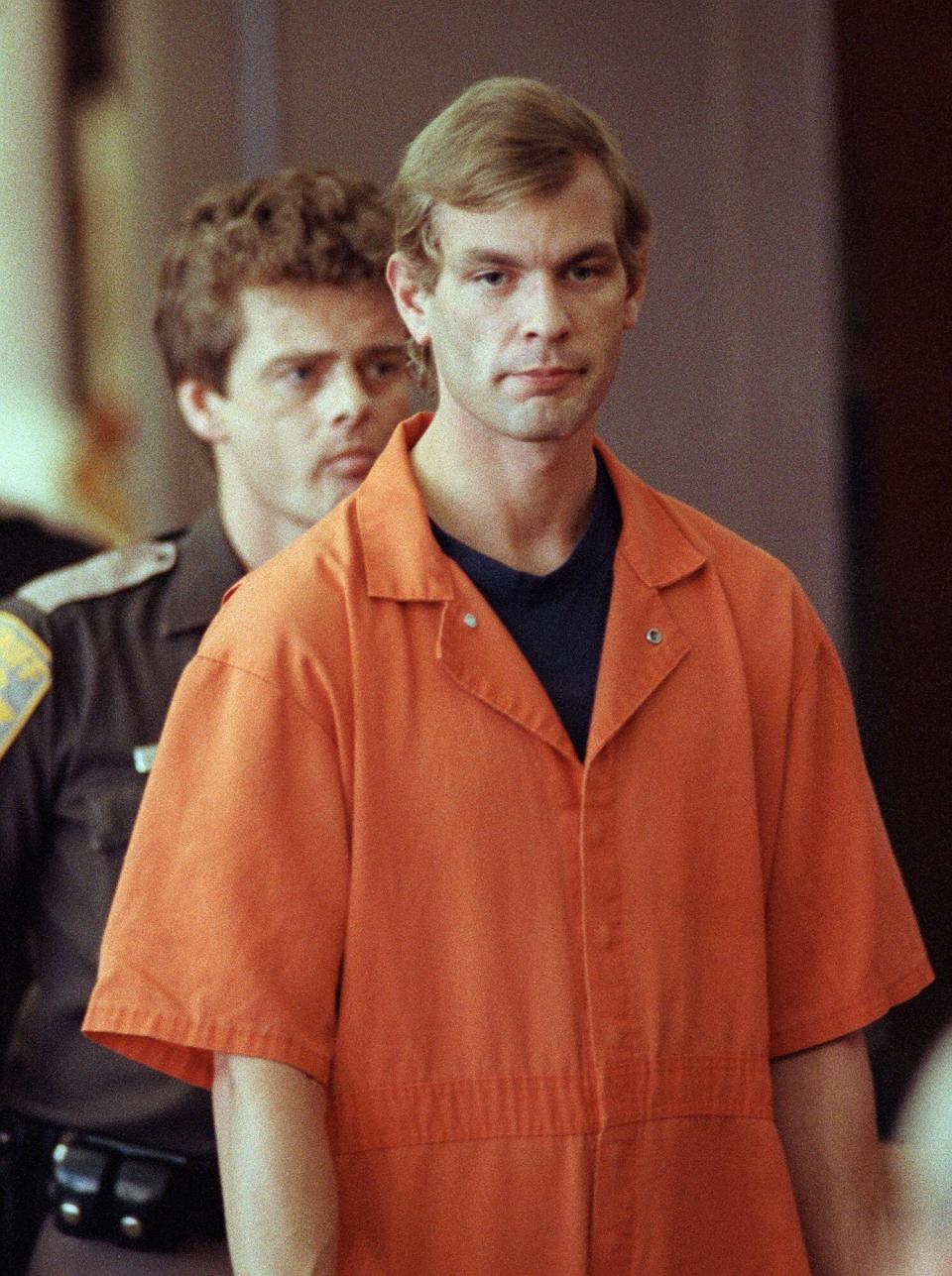 Suspected serial killer Jeffrey L. Dahmer enters the courtroom of judge Jeffrey A. Wagner 06 August 1991. Dahmer has been charged with eight additional counts of first-degree murder, bringing the number of homicides he is charged with to 12. The judge increased Dahmer's bail to five million dollars. He was sentenced to fifteen consecutive life terms or a total of 957 years in prison. Dahmer was killed by a fellow prisoner, Christopher Scarver, 28 November 1994 at Columbia Correctional Institution, Portage, Wisconsin.