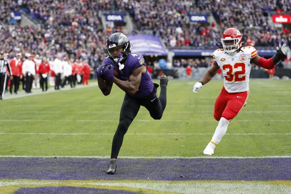 Jan 28, 2024; Baltimore, Maryland, USA; Baltimore Ravens wide receiver Zay Flowers (4) catches a touchdown pass in front of Kansas City Chiefs linebacker Nick Bolton (32) during the first half in the AFC Championship football game at M&T Bank Stadium. Mandatory Credit: Geoff Burke-USA TODAY Sports