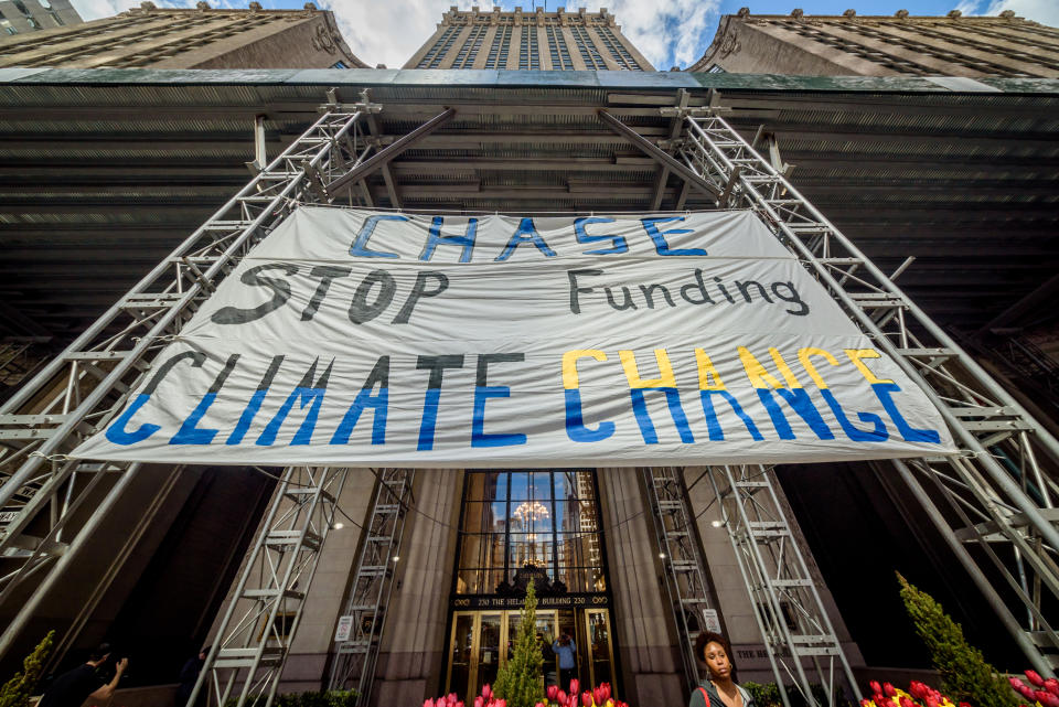 PARK AVENUE, NEW YORK, UNITED STATES - 2019/04/10: As CEO Jamie Dimon testifies in front of the House Financial Services Committee Hearing, a large coalition of activists and community leaders rallied across the country in a national day of action holding the worlds worst funder of fossil fuels, JPMorgan Chase, accountable for its financing practices. In New York City, activists unfurled a giant banner in Park Avenue across JP Morgan Chase headquarters. (Photo by Erik McGregor/Pacific Press/LightRocket via Getty Images)