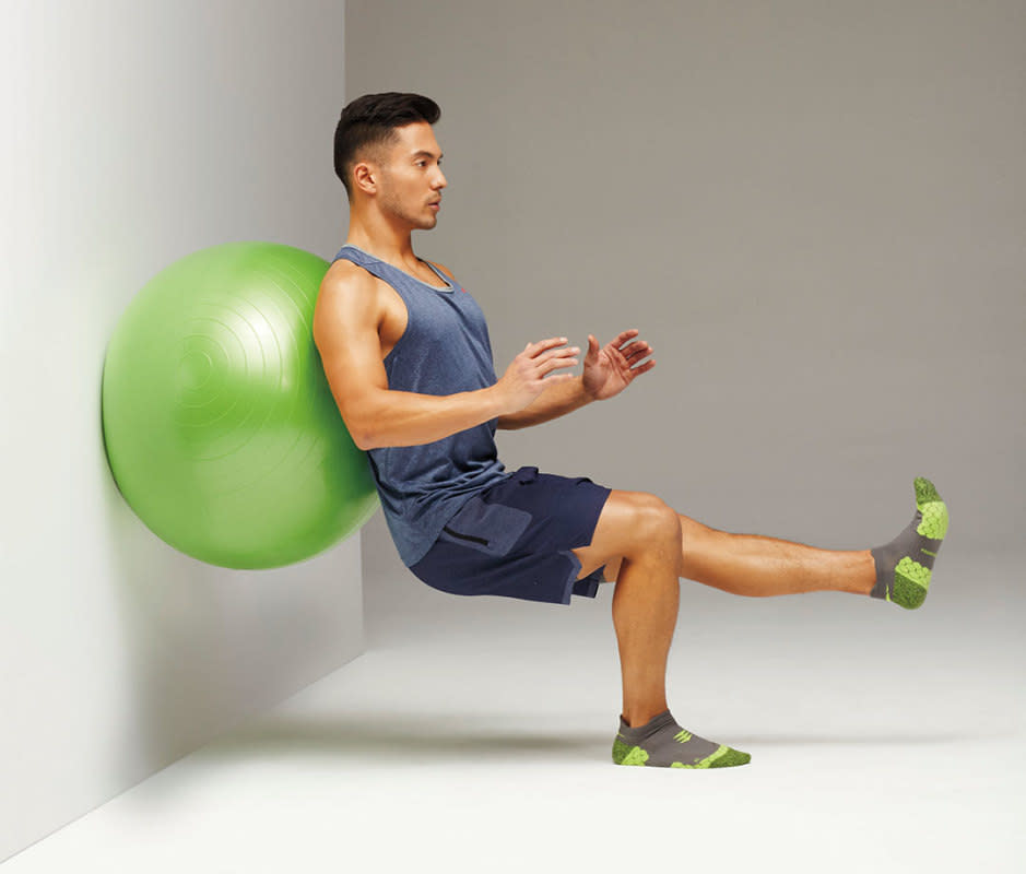 How to do it:<ol><li>Stand with the ball between your lower back and a wall.</li><li>Straighten left leg and flex foot to start.</li><li>With core tight and shoulders engaged for stability, lower hips, allowing the ball to travel up back, until the left leg is parallel to the floor.</li><li>Reverse to start for one rep. Do all reps with left leg raised, then switch legs.</li></ol>
