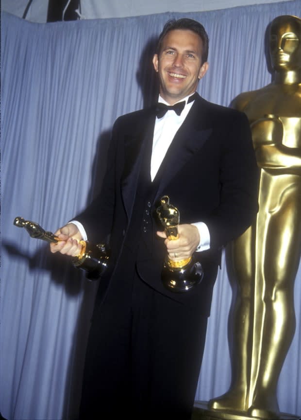 <p>Kevin Costner wins <a href="https://parade.com/movies/oscars-2023-academy-awards" rel="nofollow noopener" target="_blank" data-ylk="slk:Academy Awards;elm:context_link;itc:0;sec:content-canvas" class="link ">Academy Awards</a> for Best Picture and Best Director for <em>Dances with Wolves</em>. </p>