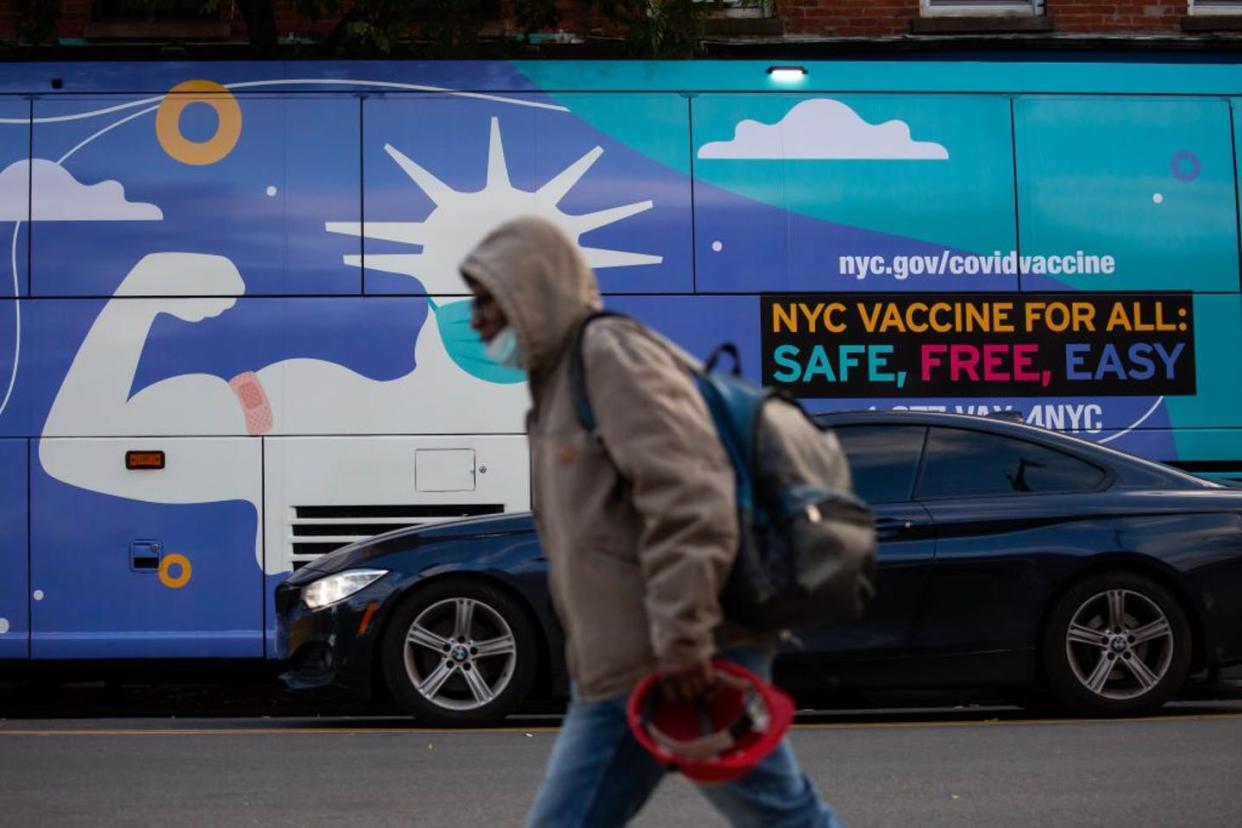 <span class="caption">COVID-19 vaccines and treatments aren't societal silver bullets when health disparities persist.</span> <span class="attribution"><a class="link " href="https://www.gettyimages.com/detail/news-photo/pedestrian-walks-in-front-of-a-covid-19-vaccination-site-in-news-photo/1236679829" rel="nofollow noopener" target="_blank" data-ylk="slk:Michael Nagle/Xinhua via Getty Images;elm:context_link;itc:0;sec:content-canvas">Michael Nagle/Xinhua via Getty Images</a></span>