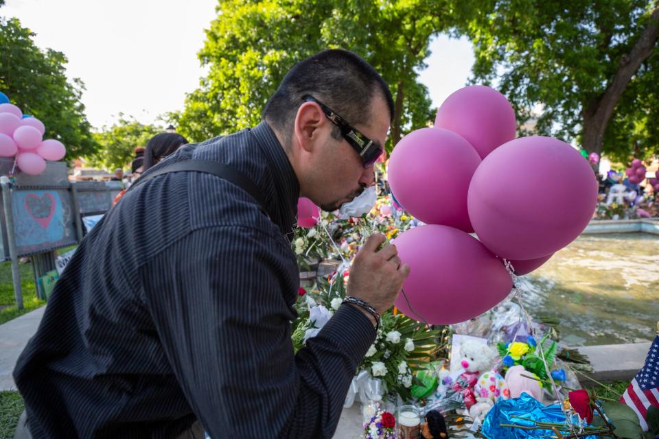 Members of the community gather at the Uvalde Town Square on May 28, 2022, for a prayer service for the 19 children and two adults who were killed at Robb Elementary School by a gunman.