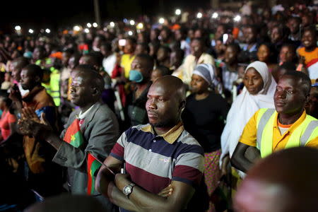 Supporters of President-elect Roch Marc Kabore watch Kabore speak at his campaign headquarters in Ouagadougou, December 1, 2015. REUTERS/Joe Penney