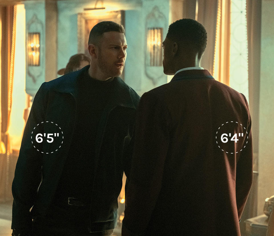 The Umbrella Academy’s Tom Hopper (left) and Justin Cornwell wear boots that elevate them above other castmembers and also put them at the same height. - Credit: Courtesy of Christos Kalohoridis/Netflix